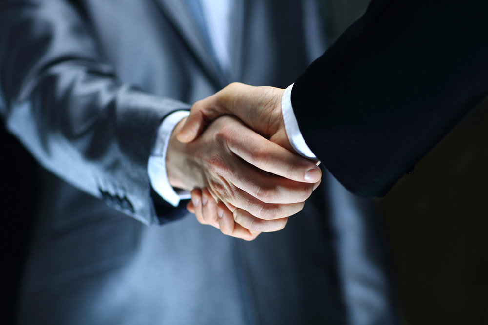 Lawyer shaking hands with client